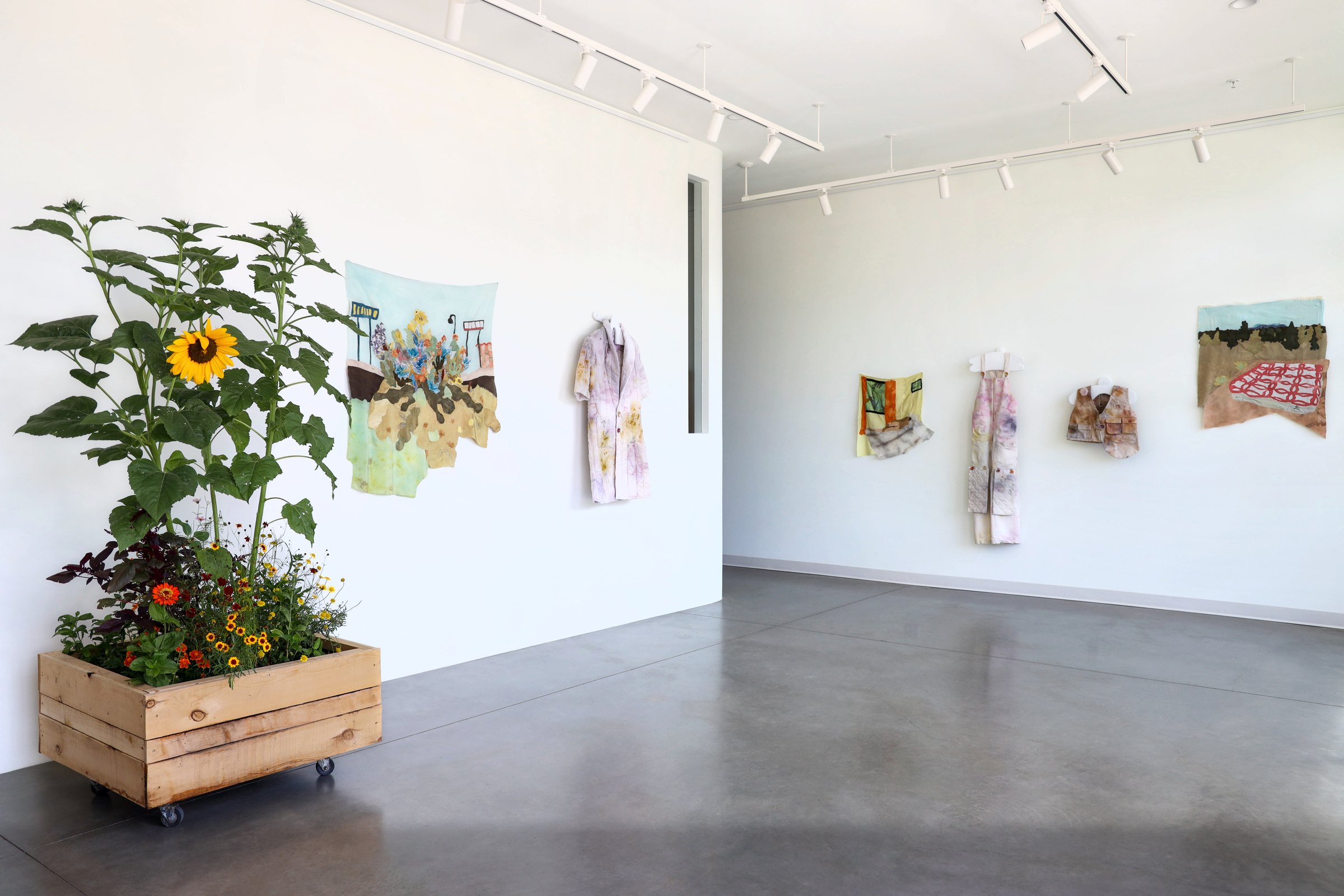 Gallery view with the living garden planter and silk collages
